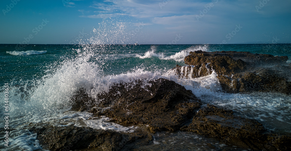 waves crashing on rocks