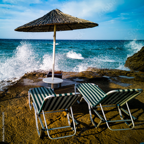 Obraz na płótnie beach with umbrellas and chairs w salonie