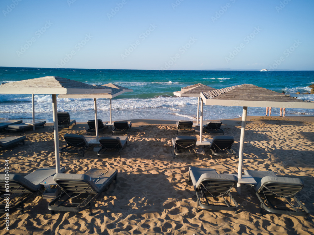 beach with umbrellas and chairs
