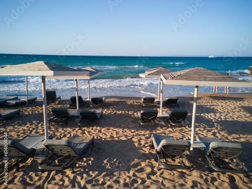 Obraz na płótnie beach with umbrellas and chairs w salonie