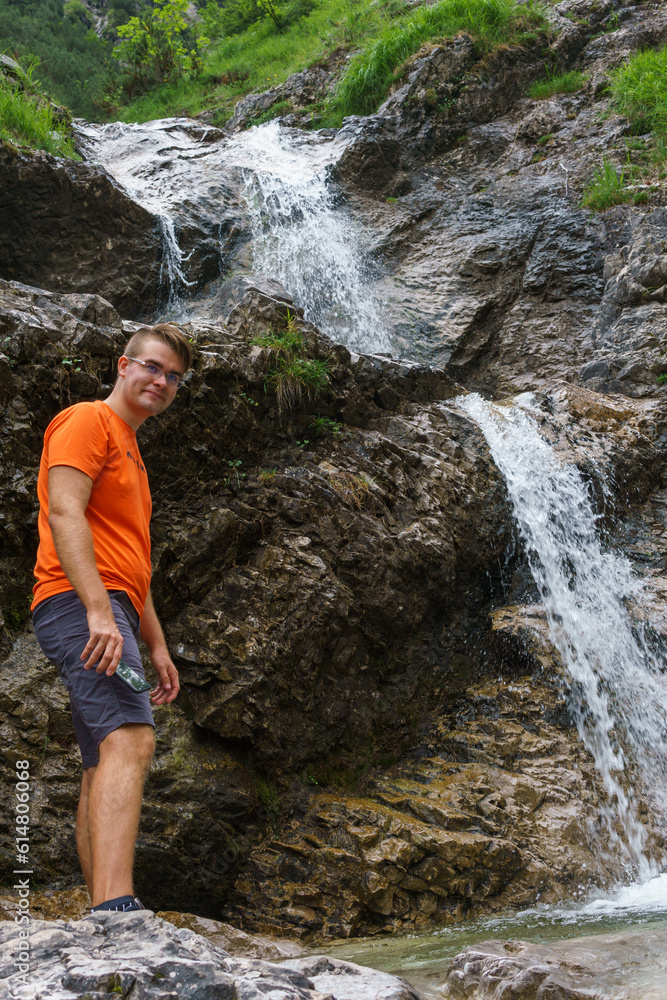 person on the waterfall person on the waterfall