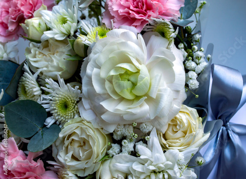 bouquet of flowers of different colors close-up. ranunculus and chrysanthemums