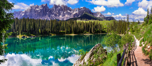 Idyllic nature scenery- trasparent mountain lake Carezza surrounded by Dolomites rocks- one of the most beautiful lakes of Alps. South Tyrol region. Italy photo