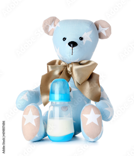Teddy bear with bottle of m...