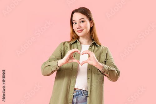 Beautiful young woman makin...