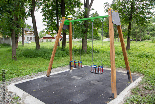 wooden children s swing in the park