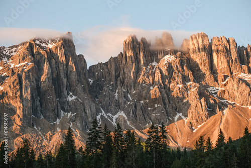 Peaks of the Latemar mountain range from Lake Carezza during sunrise. Italy Travel. Mountain landscape.