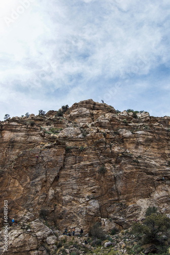 Wallpaper Mural Rock climbers at the bottom of steep rocky cliff in the Sonora Desert, Arizona Torontodigital.ca