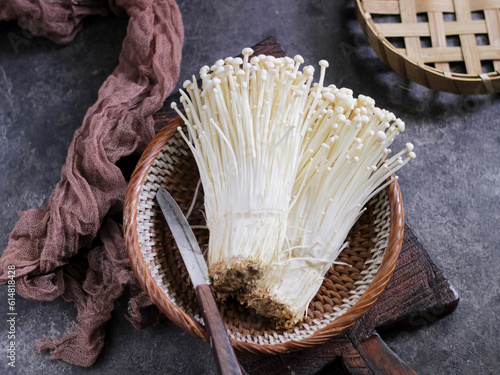 Jamur Enoki or Enoki Mushrooms, one of popular ingredients in asian cuisine. also called as needle mushroom or Enokitake. Selective focus