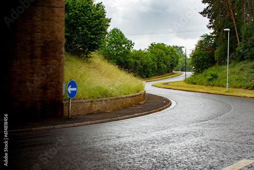 Road approach to roundabout island directional arrow