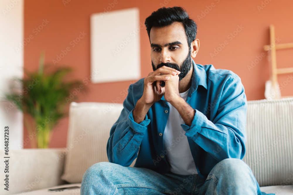 Depressed Indian Man Thinking About His Issues Sitting At Home