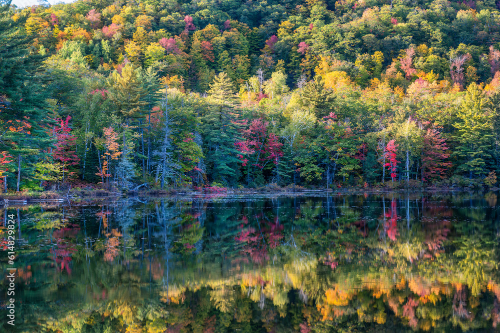 Autumn reflection - Harvey Pond in western Maine  - scenic drive on route 4 