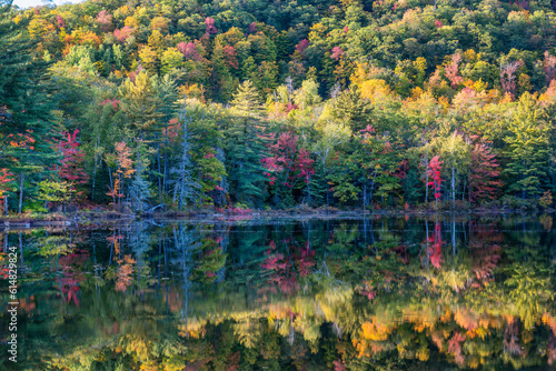 Autumn reflection - Harvey Pond in western Maine - scenic drive on route 4 