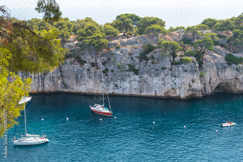 Beautiful seascape with smooth water surface and rocky cliffs in Calanques National Park. Popular travel destination in Southern France.