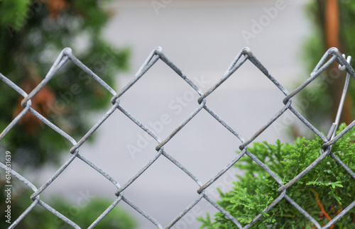chain linked fence  symbolizing confinement  barriers  and restrictions  captures the essence of limited freedom and separation
