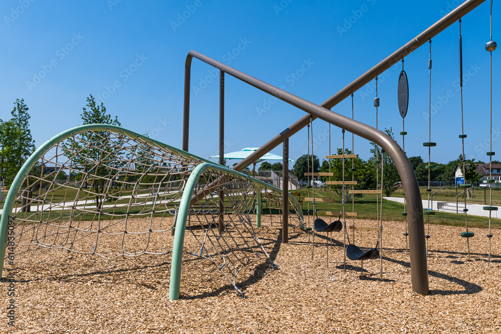 Modern wooden playground and climbing park for children and kids in suburb, concept of modern urban living Modern wooden playground and climbing park for children and kids in suburb, concept of modern urban living