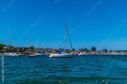 A view of sail boats moored on the River Hamble, Hampshire in summertime © Nicola
