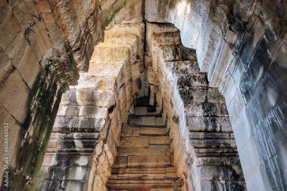 Ancient stone vaulted ceiling and walls, Cambodian stone construction. Ancient stone vaulted ceiling and walls, Cambodian stone construction.