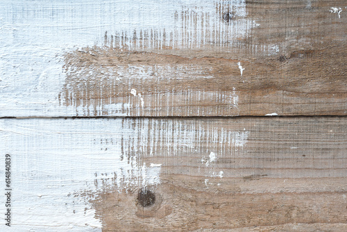 Fotografie untreated wood with partially applied white paint