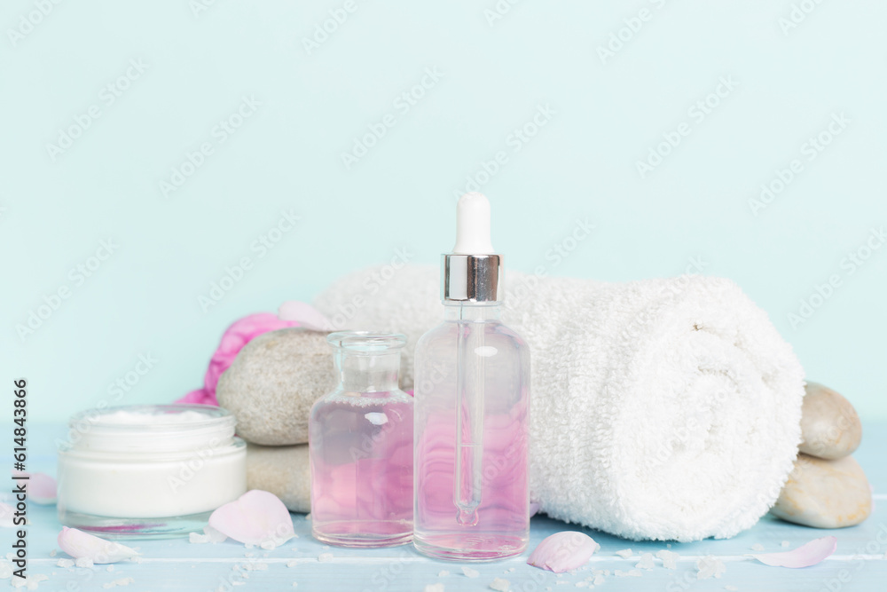 Spa composition with pink roses on wooden table Spa composition with pink roses on wooden table