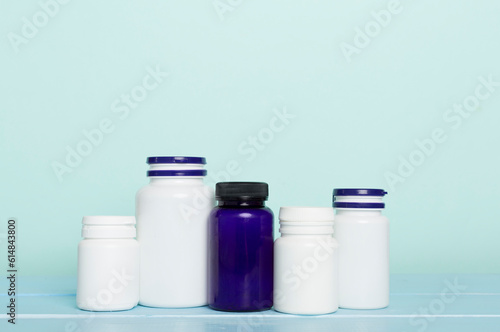 Plastic bottles for vitamins on wooden table