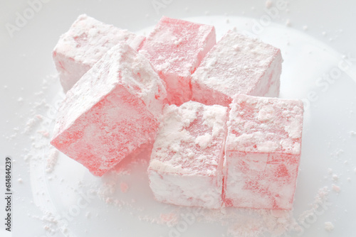 Turkish delight or lokum on a white plate. photo