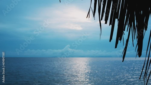 Azure cloudy sky with bright summer tropical sun and turquoise sea or ocean. Sky-blue tropical paradise, perfect place to relax. Idyllic unfeasible dream of perfect vacation at sea. Seascape landscape photo