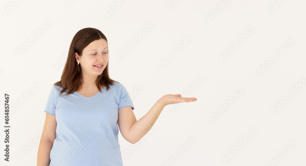 Beautiful caucasian woman expecting a baby, touching pregnant belly smiling cheerful presenting and pointing with palm of hand looking at the camera. Beautiful caucasian woman expecting a baby, touching pregnant belly smiling cheerful presenting and pointing with palm of hand looking at the camera.