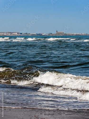 View from Cambois beach to Newbiggin by the Sea, Northumberland, UK photo