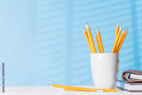Pencils and notepads on an office desk