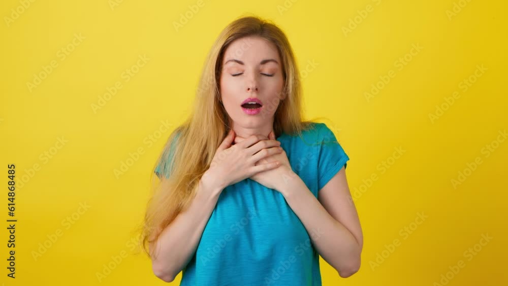 Sadness, anger and worried stressed woman with excitement emotion. Upset sad lady female screaming, closed eyes, cover ears for crisis stress or problem, studio isolated on yellow background Sadness, anger and worried stressed woman with excitement emotion. Upset sad lady female screaming, closed eyes, cover ears for crisis stress or problem, studio isolated on yellow background