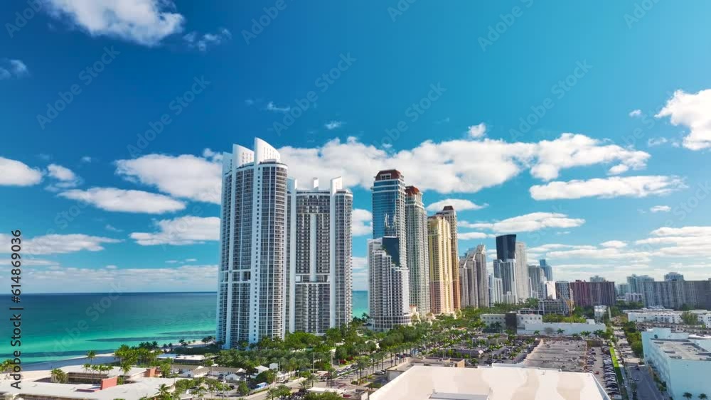 Expensive highrise hotels and condos on Atlantic ocean shore in Sunny Isles Beach city. American tourism infrastructure in southern Florida Expensive highrise hotels and condos on Atlantic ocean shore in Sunny Isles Beach city. American tourism infrastructure in southern Florida