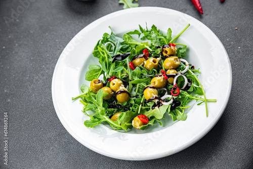 olive salad hot chili pepper, green mix lettuce, arugula meal food snack on the table copy space food background rustic top view