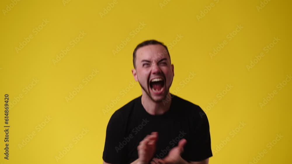 4k video of one man who supporting someone over yellow background. 4k video of one man who supporting someone over yellow background.