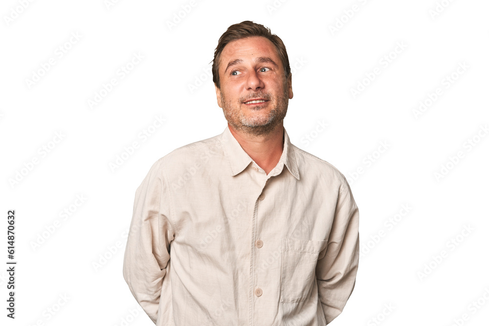 A middle-aged man isolated relaxed and happy laughing, neck stretched showing teeth. A middle-aged man isolated relaxed and happy laughing, neck stretched showing teeth.