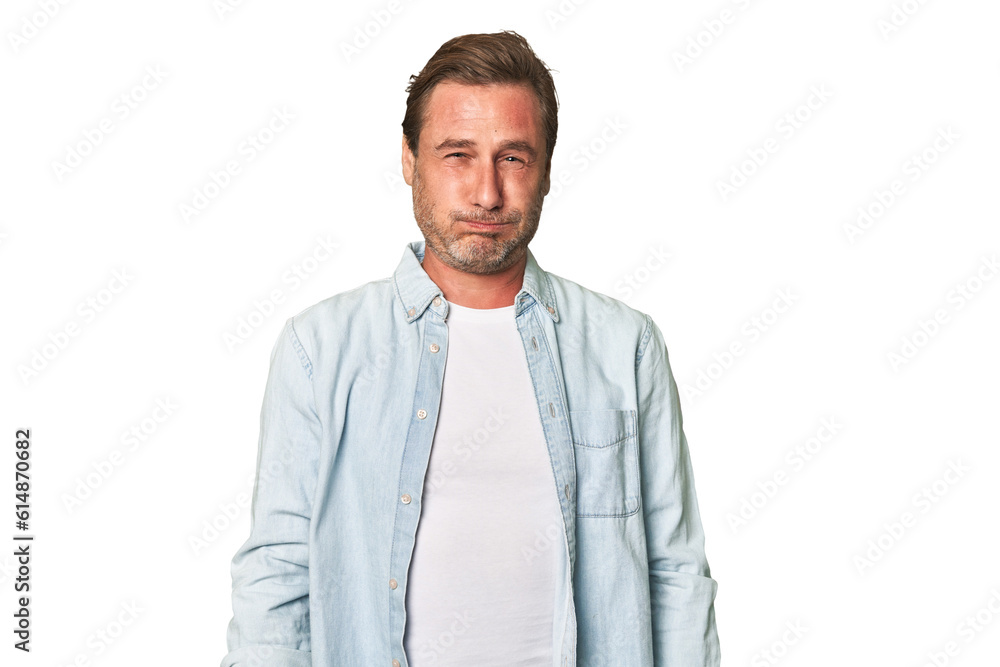 A middle-aged man isolated blows cheeks, has tired expression. Facial expression concept. A middle-aged man isolated blows cheeks, has tired expression. Facial expression concept.