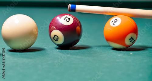 Colorful closeup of billiard balls and sticks on the table