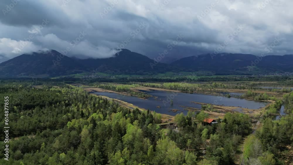 Aerial panorama view of bog lake landscape with forest under sky with clouds, Moorstation Nicklheim, Germany, 4k Aerial panorama view of bog lake landscape with forest under sky with clouds, Moorstation Nicklheim, Germany, 4k
