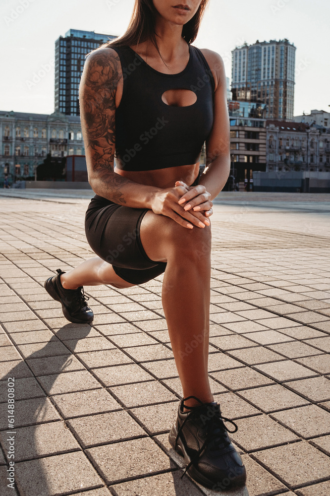 Beautiful young fit tanned caucasian woman exercising outdoors Beautiful young fit tanned caucasian woman exercising outdoors