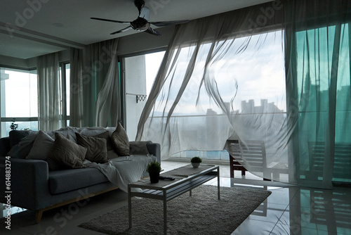 Konstfotografi The wind rustles the curtain of the panoramic window with a cityscape