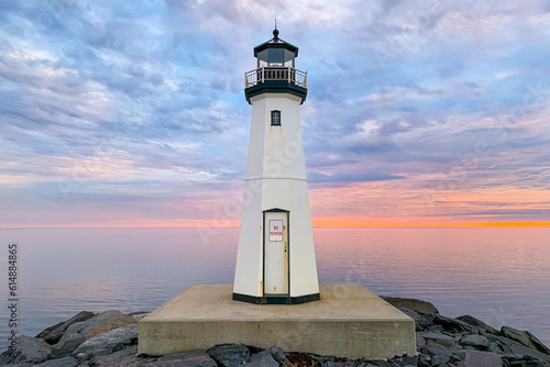 Sandspit Park Lighthouse and fishing pier in Patchogue New York, Long Island, with colorful sunset clouds and colors