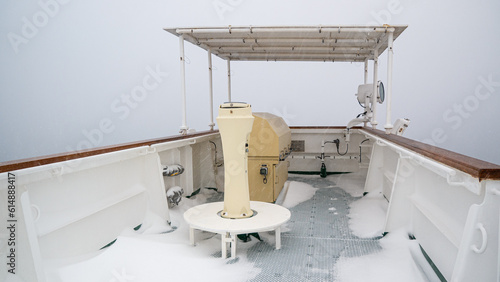 Foto Side wing of large cargo vessel with gyro repeater and navigational console full