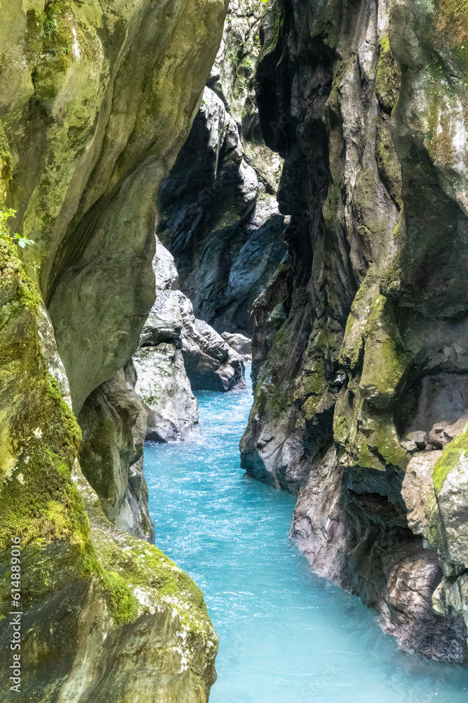 Crystal clear Soca river, one of the most beautiful european rivers, deep in the rocky canyon of slovenian Alps Crystal clear Soca river, one of the most beautiful european rivers, deep in the rocky canyon of slovenian Alps