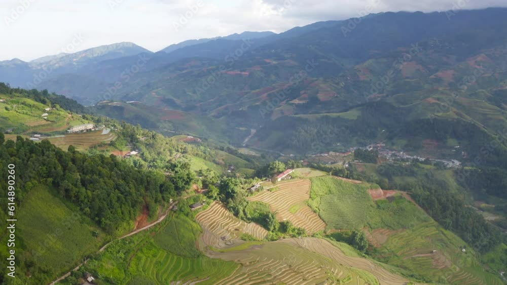 Aerial top view of fresh paddy rice terraces, green agricultural fields in countryside or rural area of Mu Cang Chai, mountain hills valley in Asia, Vietnam. Nature landscape background. Aerial top view of fresh paddy rice terraces, green agricultural fields in countryside or rural area of Mu Cang Chai, mountain hills valley in Asia, Vietnam. Nature landscape background.