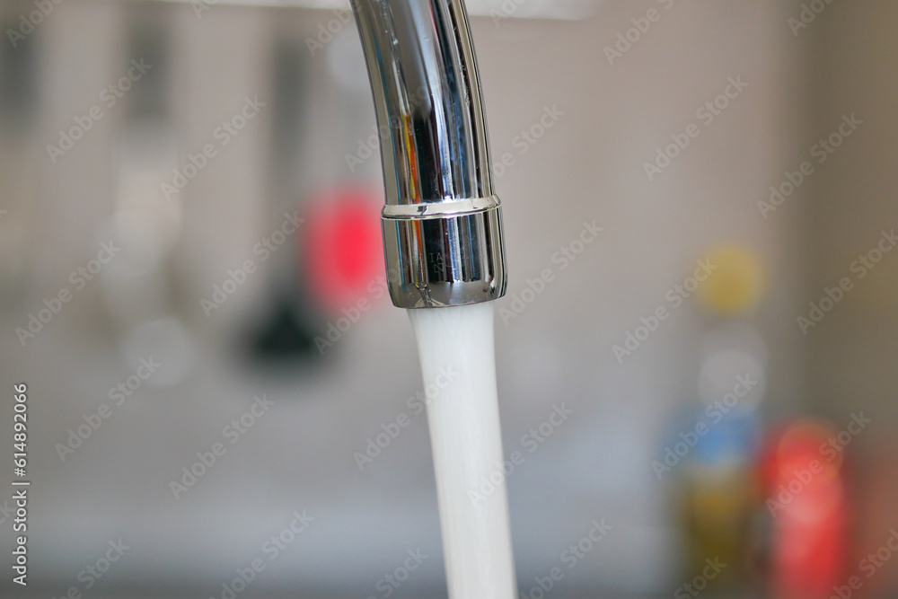 water pouring from a faucet tap slow motion water pouring from a faucet tap slow motion
