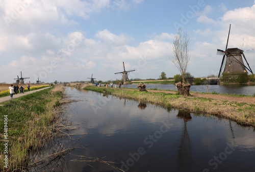 Kinderdijk, the Netherlands - April 17, 2023: 19 windmills at Kinderdijk built about 1740 is part of a larger water management system to prevent flooding. A UNESCO world heritage site.
