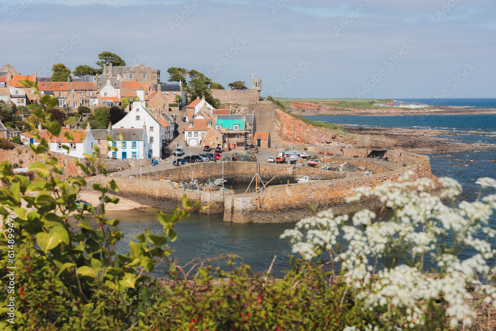 View of the quaint and picturesque harbour of the seaside fishing village Crail on a sunny summer day in East Neuk, Fife, Scotland.