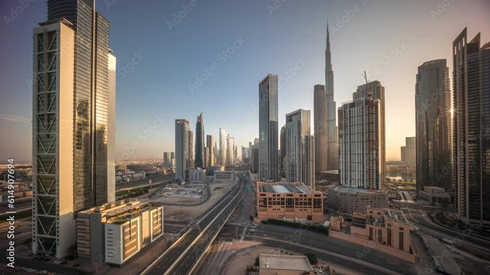 Aerial view of Dubai Downtown skyline during sunrise with long moving shadows from tall towers timelapse. Business area in smart urban city. Skyscrapers and high-rise buildings from above, UAE. Aerial view of Dubai Downtown skyline during sunrise with long moving shadows from tall towers timelapse. Business area in smart urban city. Skyscrapers and high-rise buildings from above, UAE.