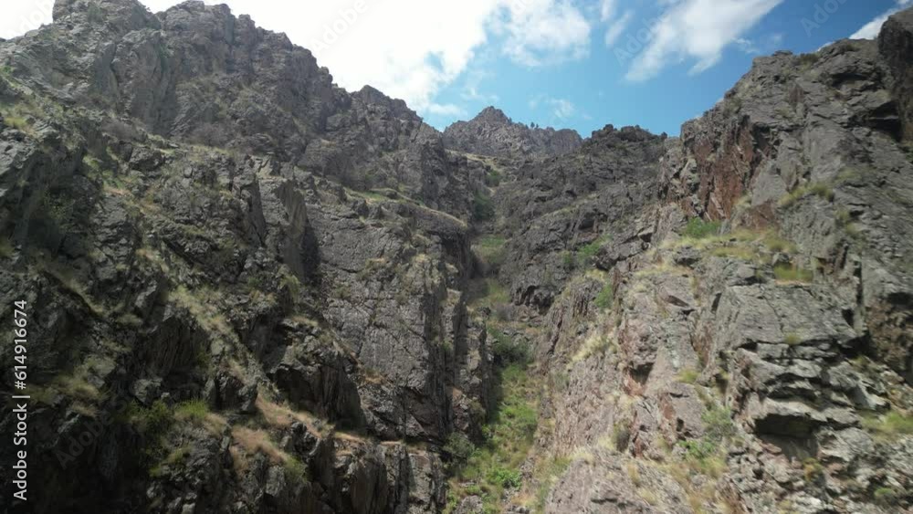 Aerial up jagged rocky canyon wall of Hells Canyon above Snake River in Idaho Aerial up jagged rocky canyon wall of Hells Canyon above Snake River in Idaho