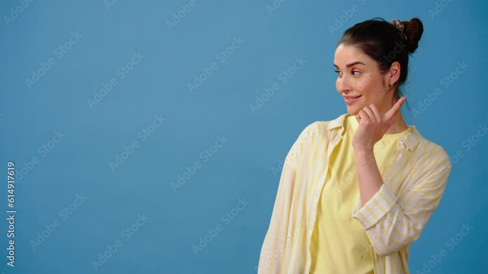 Surprised woman points fingers at promotional products Surprised woman points fingers at promotional products